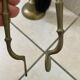 Vintage brass fireplace tool set with shell decoration.