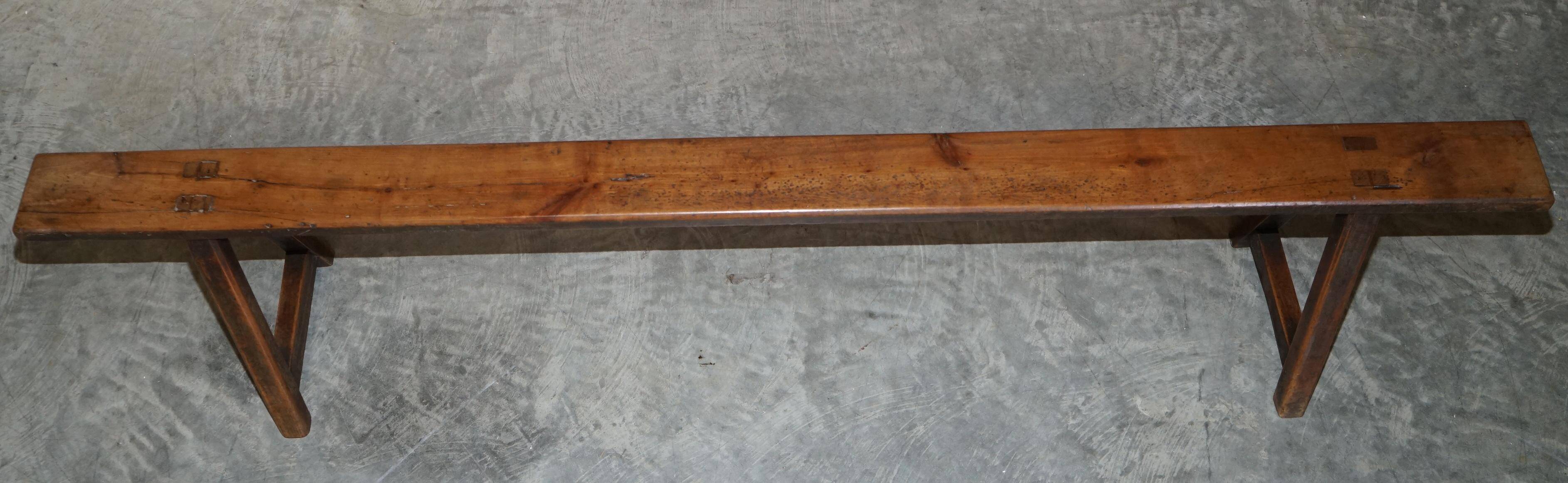 Pair of antique Victorian trestle benches in fruitwood.