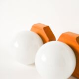 Pair of globe wall lights in opaline with a pine base, 1980.