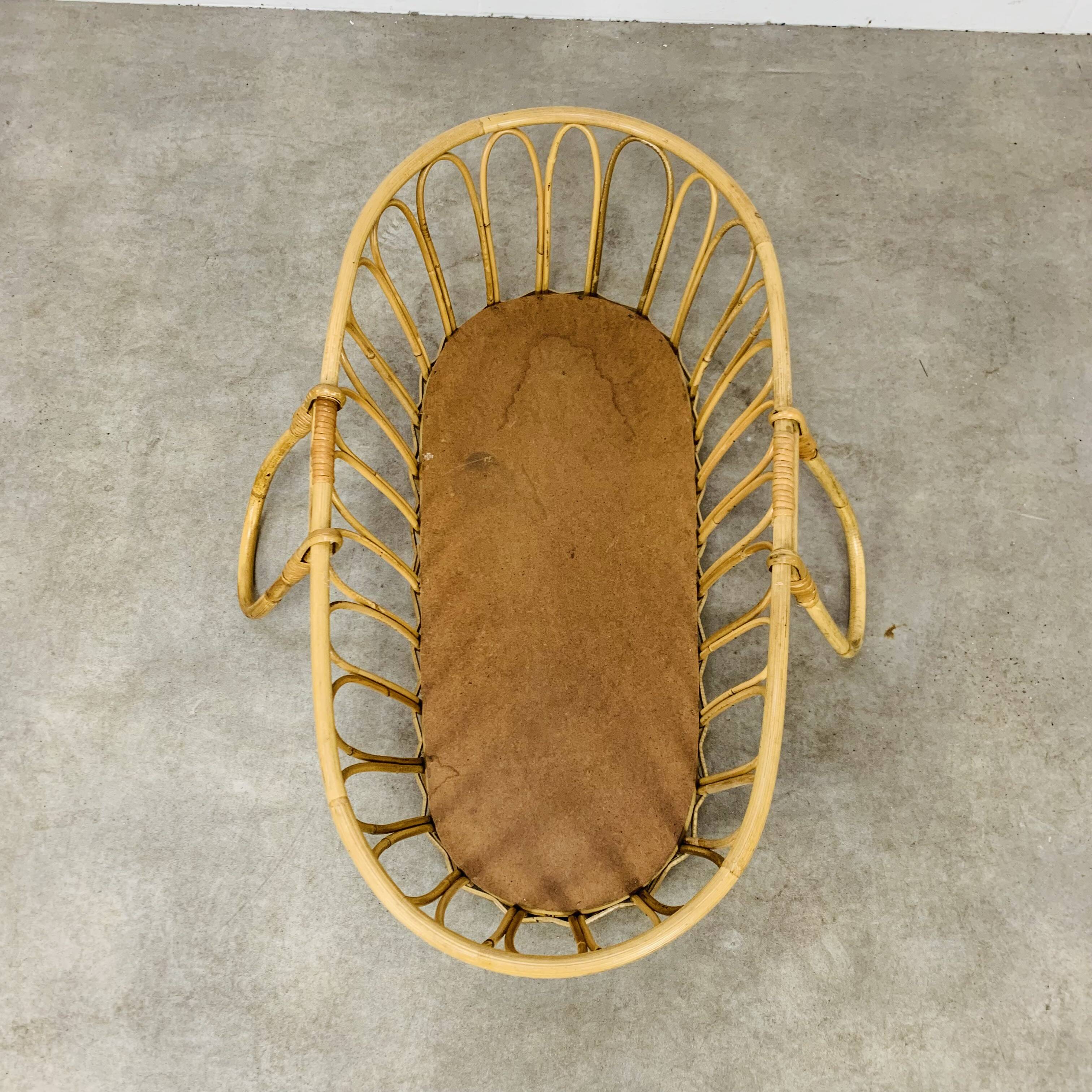 Vintage rattan baby bassinet