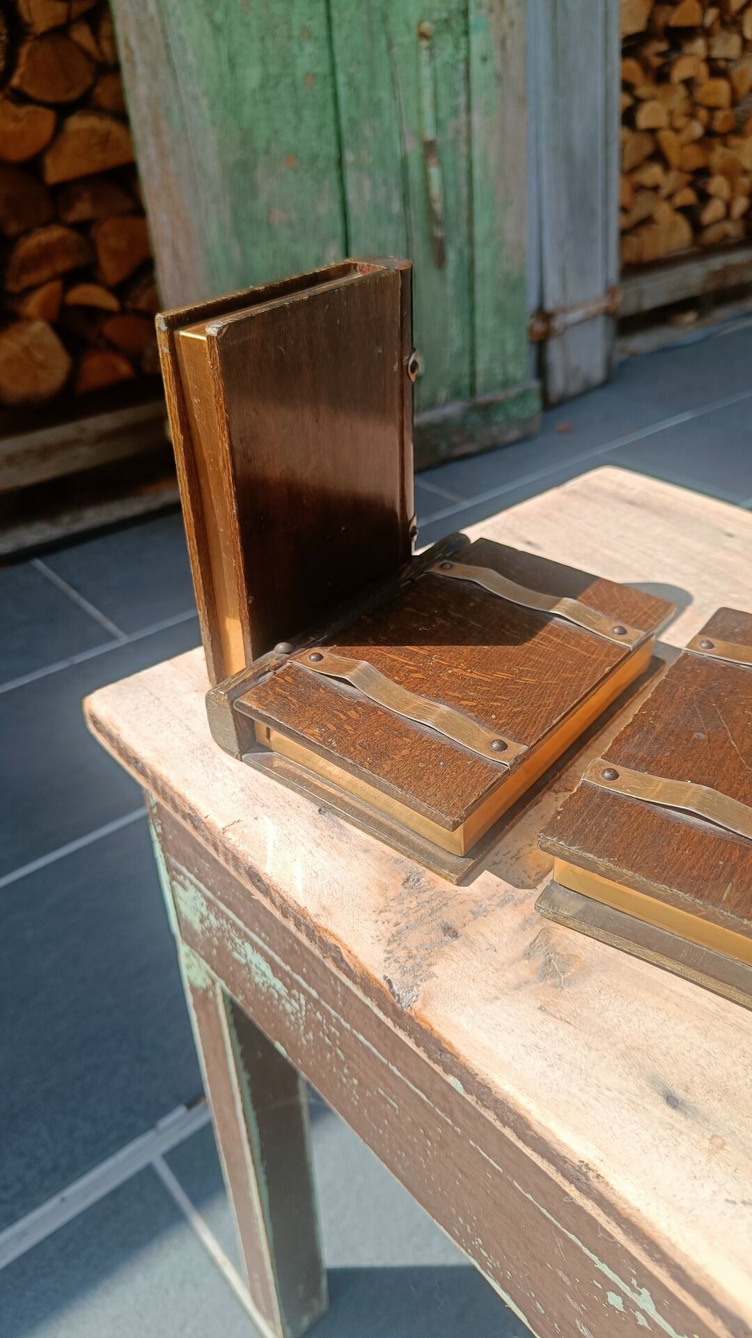 Wooden trompe-l'œil bookends with a book and box