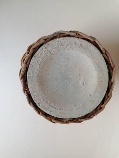 Rattan vase on ceramic