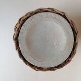 Rattan vase on ceramic