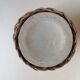 Rattan vase on ceramic