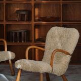 Pair of clam chairs in lambswool, Skive Møbelfabrik, Denmark, 1950s