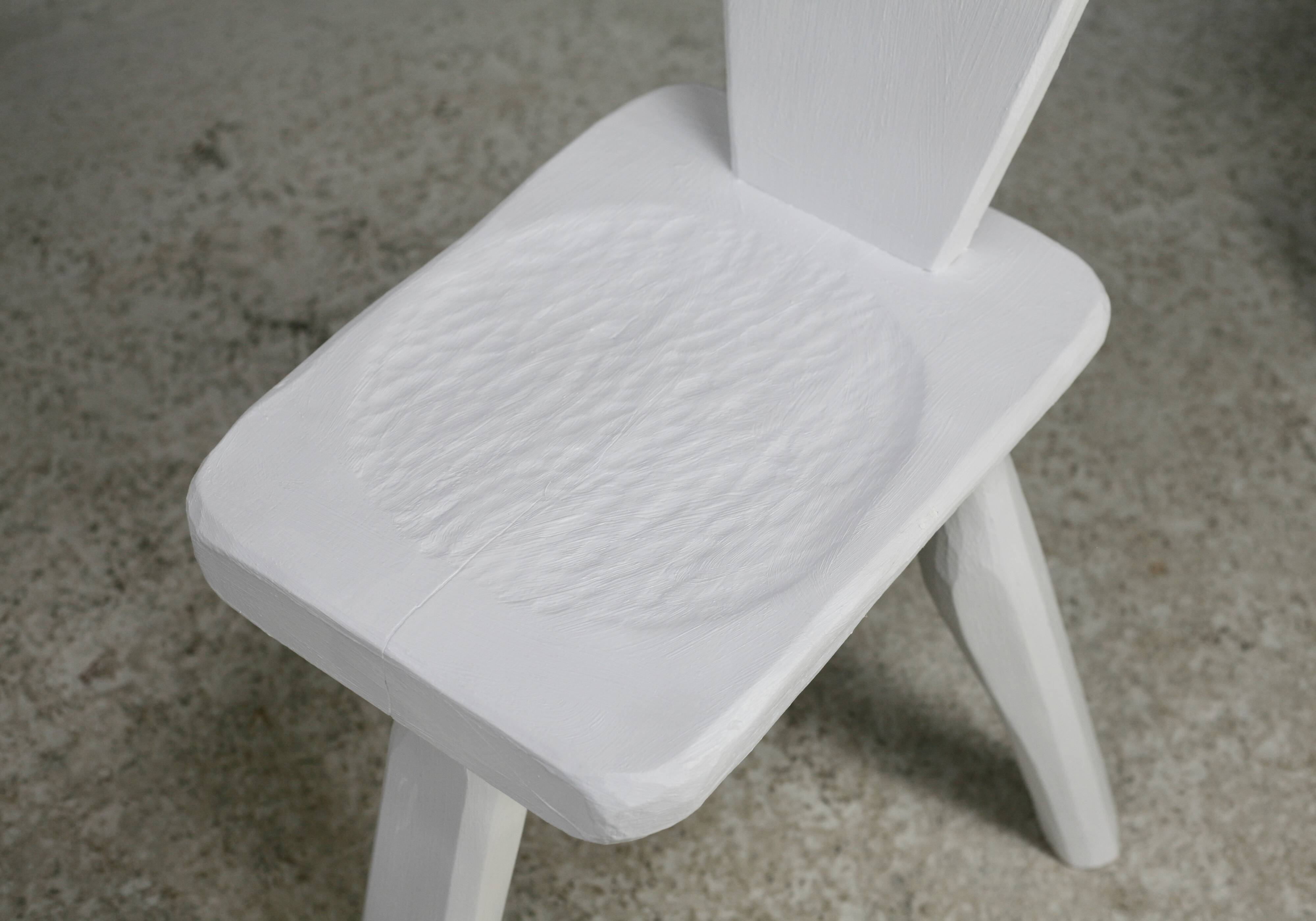 Pair of tripod chairs, gouged seats. Brutalist, circa 1960. Painted wood.