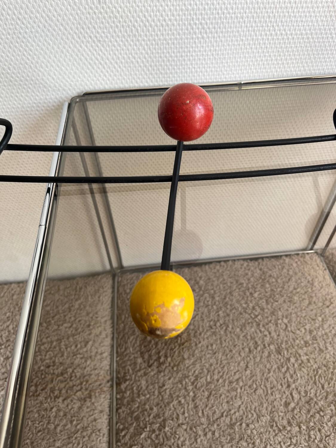 Iron wall coat rack and wooden hooks from the 60s