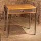 Small dressing table with chrome legs and oak laminate.