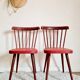 Pair of wooden bistro chairs and red imitation seating