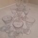 Set of 9 small cut glass stemmed glasses from the 1930s, in various sizes.