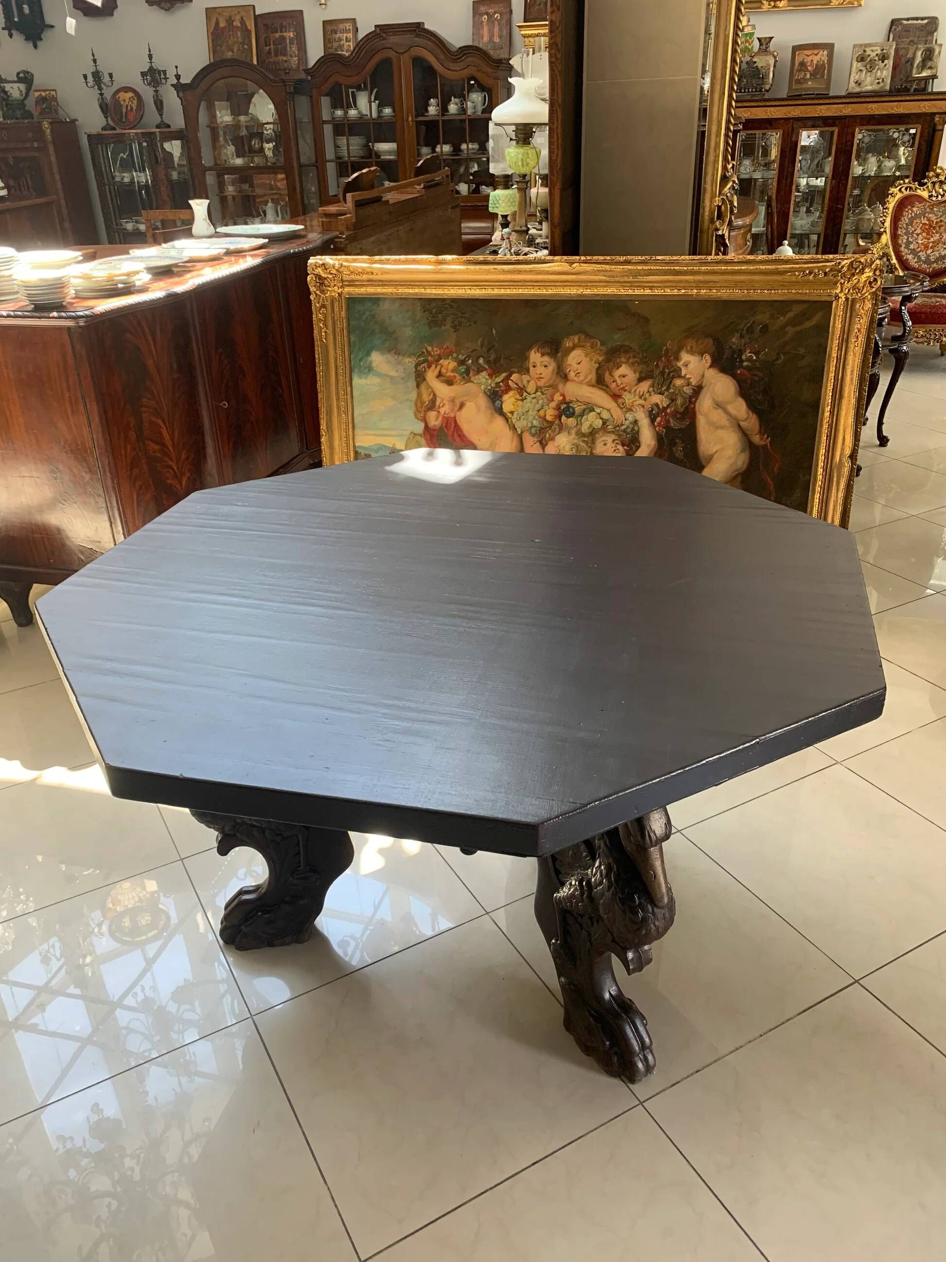 Octagonal oak table, 19th century, with griffins.