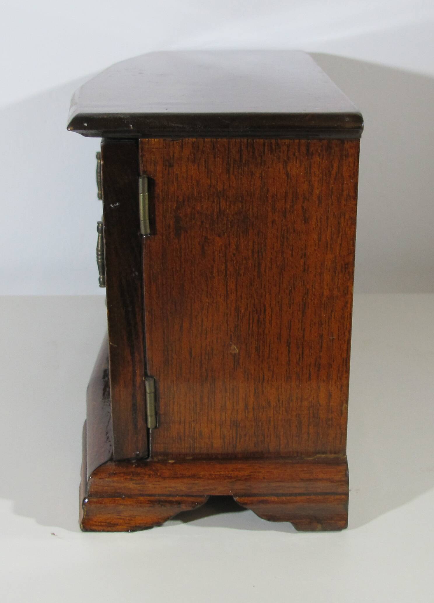 Wooden jewelry box in the shape of a dresser