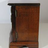 Wooden jewelry box in the shape of a dresser