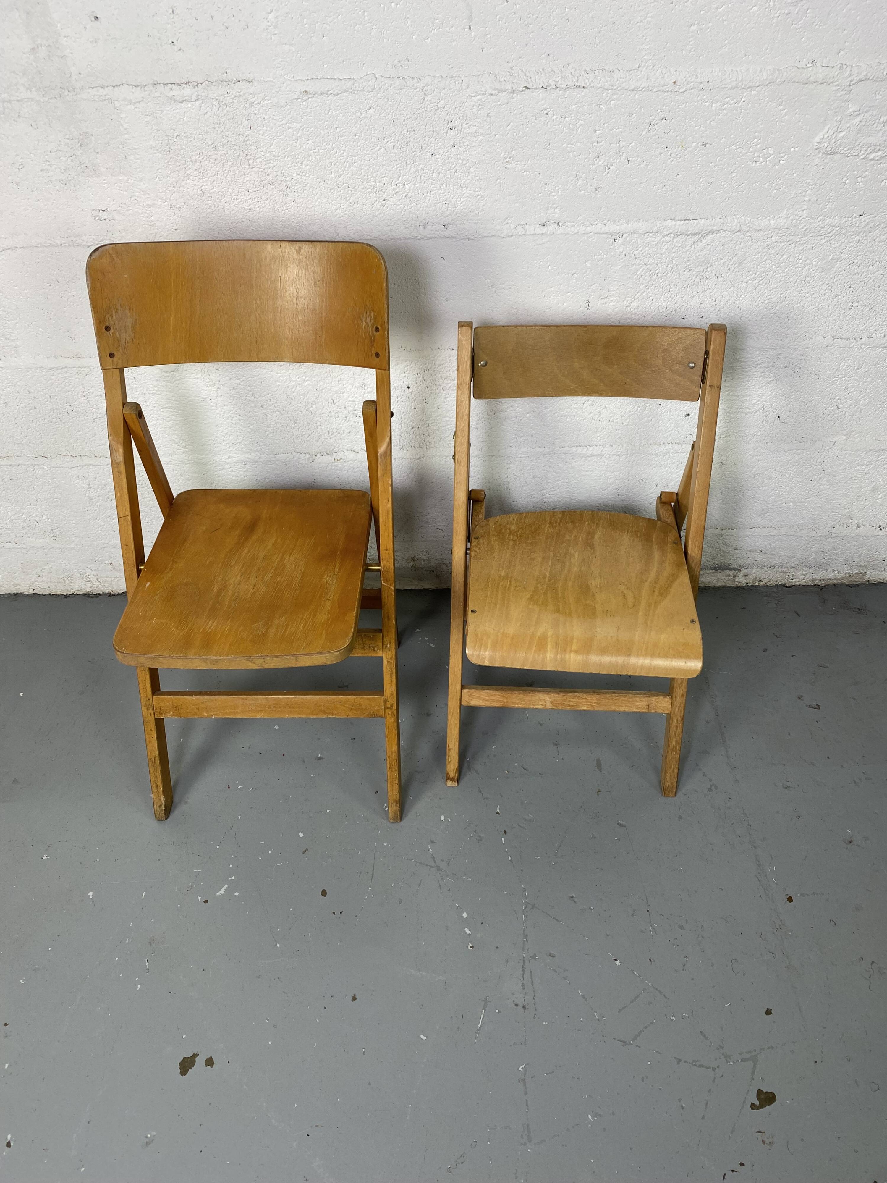 Pair of mismatched wooden folding chairs