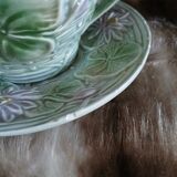 Antique cup and saucer in majolica.
