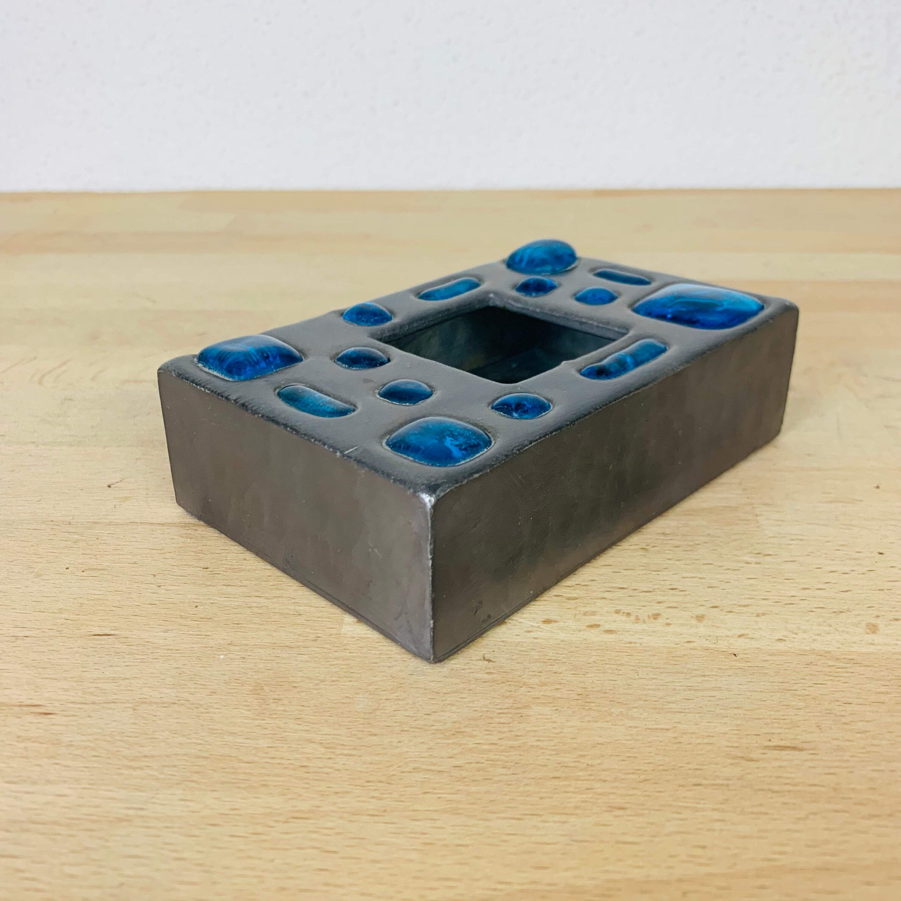 Decorative metal box and blue glass