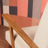 Vintage beige bouclé armchair with walnut wood from the 1950s.