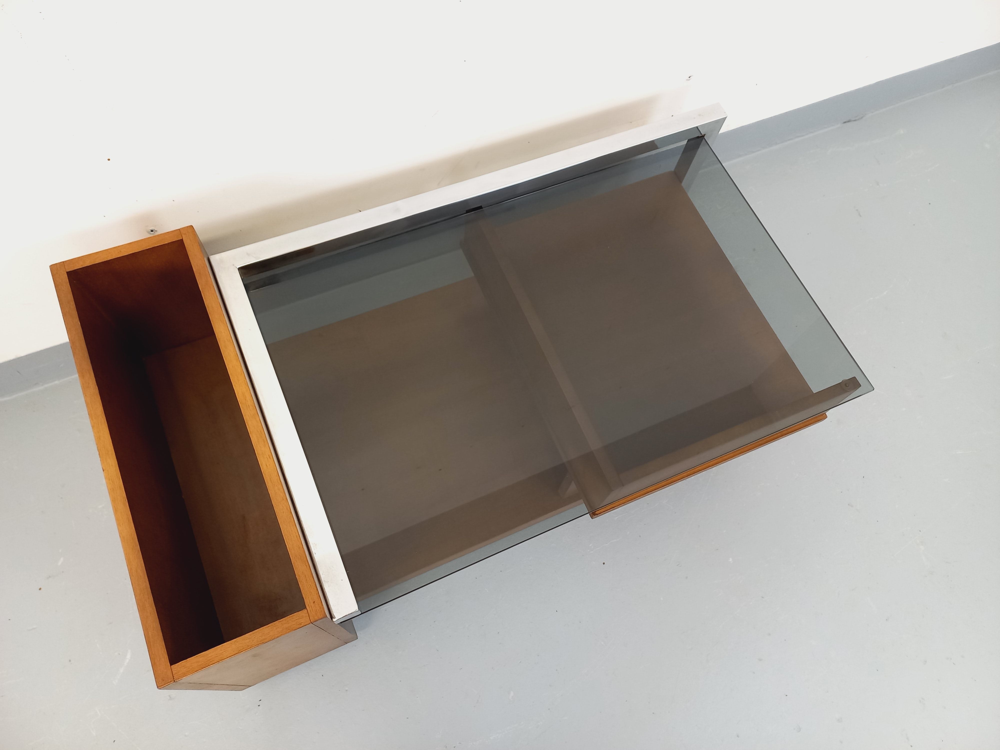 Rectangular vintage modernist coffee table with wooden niches, chrome.