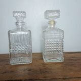 Mismatched pair of whisky decanters.