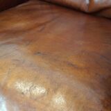 Comfortable Art Deco design armchair in cognac-colored sheepskin combined with wood