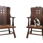 Pair of brutalist oak lounge chairs with rush seats, circa 1935