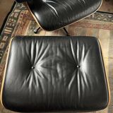 Black leather Eames Vitra armchair, original with rosewood ottoman.