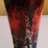 Service to orangeade of Vallauris ceramic lava aspect of black, red and white color.