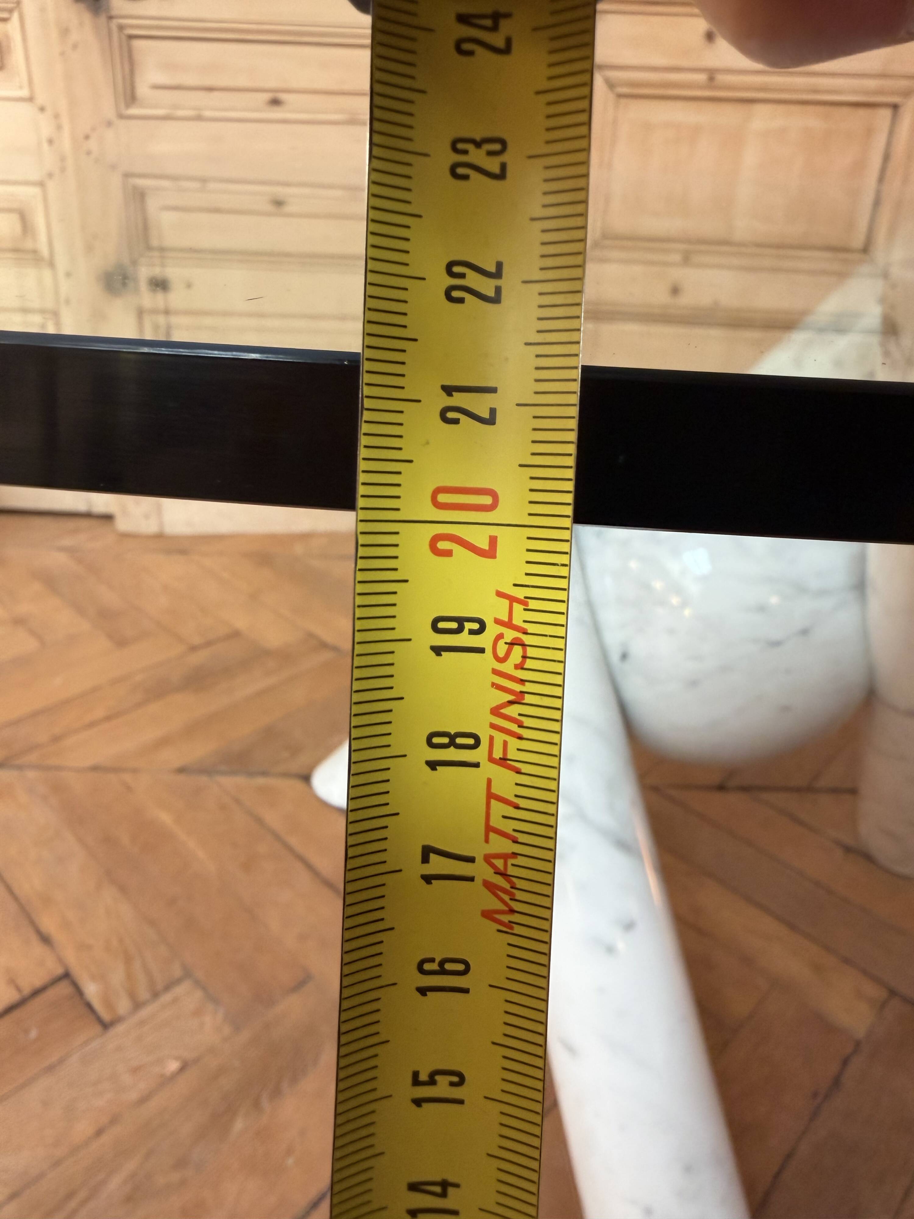 Dining table with glass top and marble base, Ligne Roset.