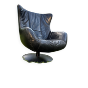 Egg chair style armchair and its ottoman.