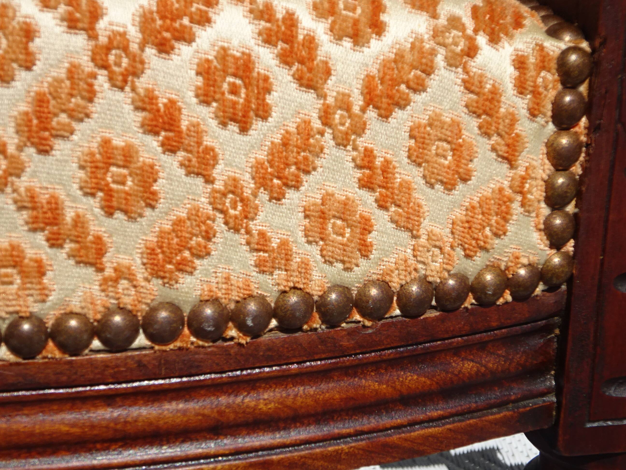 Old bench in wood and orange velvet