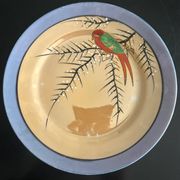 7 assiettes irisées à décor d'oiseau