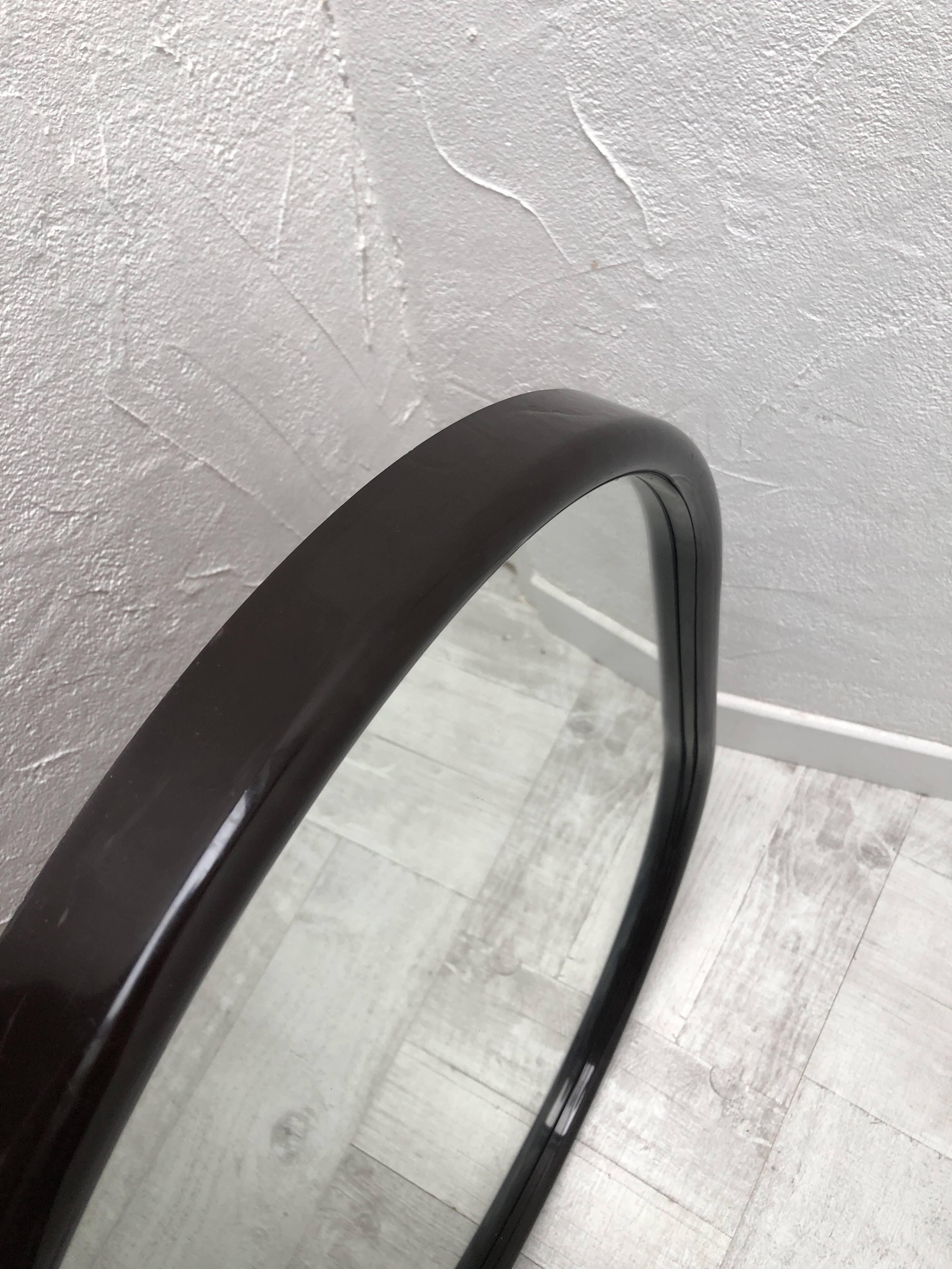Brown plastic oval mirror, 1960s/1970s