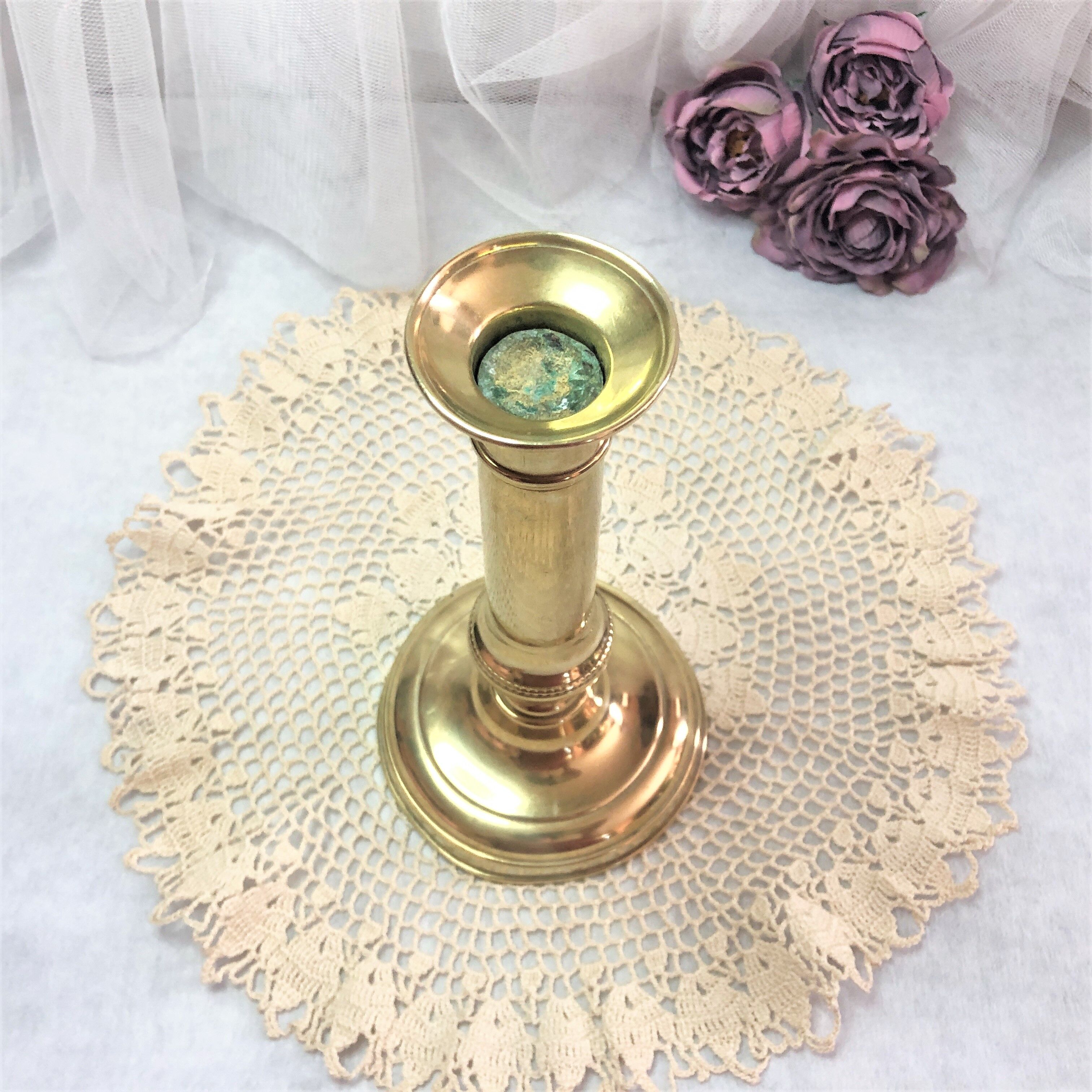 Gilded copper push candle holder