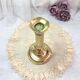 Gilded copper push candle holder