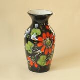 Vintage black ceramic vase with painted floral decoration – stylised colourful flowers.