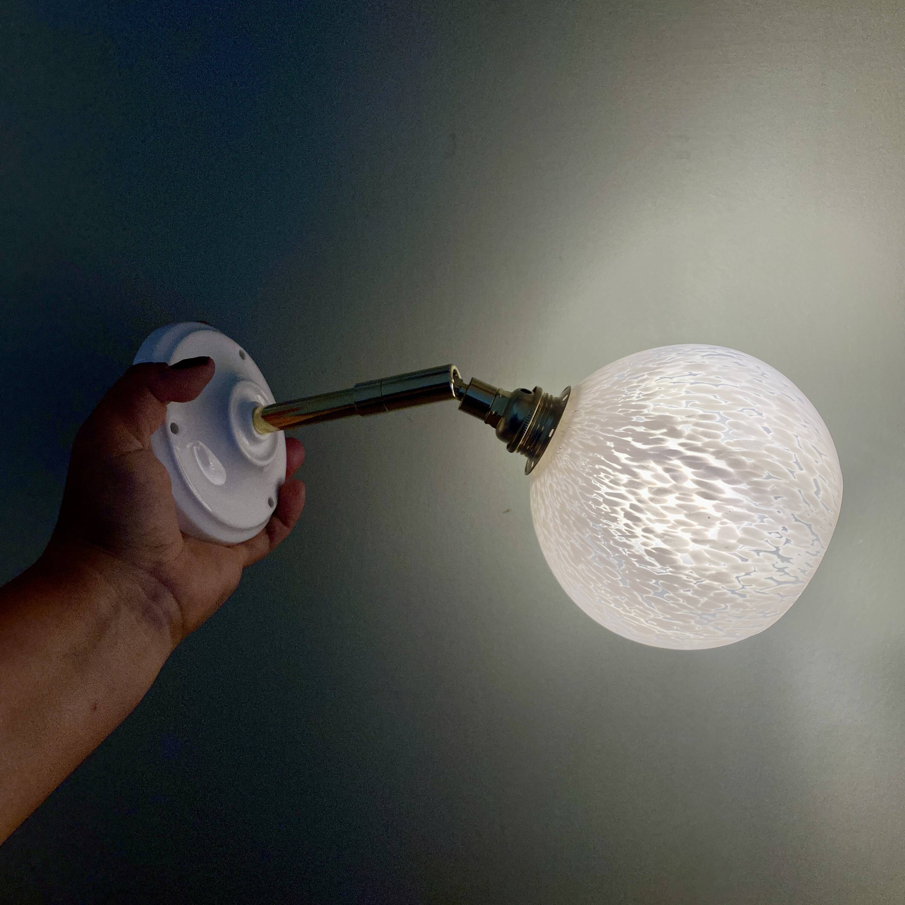 Vintage globe wall lamp in white Clichy glass