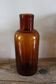 Amber glass bottle vase