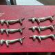 Series of vintage Dachshund knife holders in silver metal