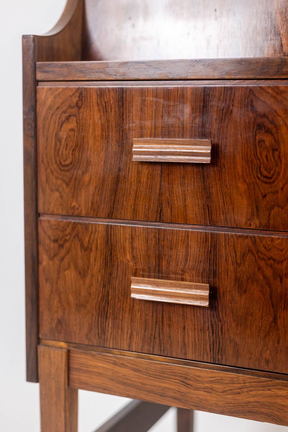 Rosewood chest of drawers with 2 drawers, forming a secretary. 1970s.