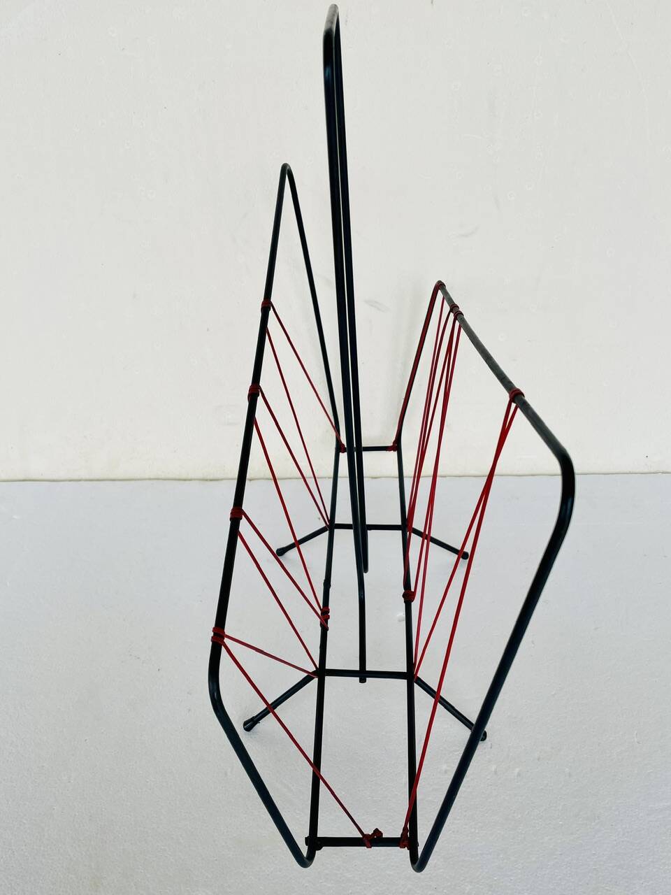 Vintage black metal magazine rack circa 19