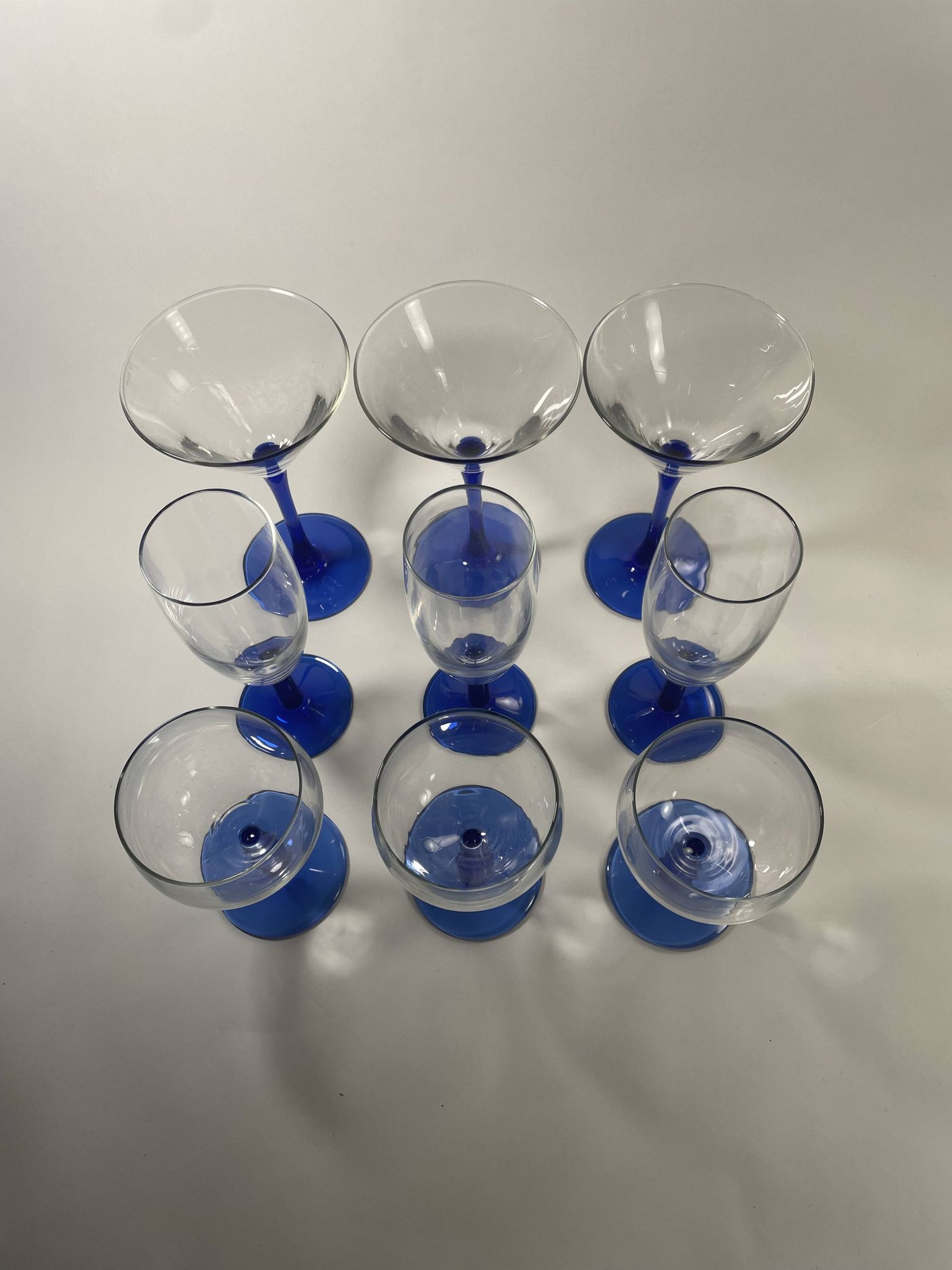 Set of 9 blue stemmed glasses (3 balloon wine glasses, 3 flutes, 3 cocktail)