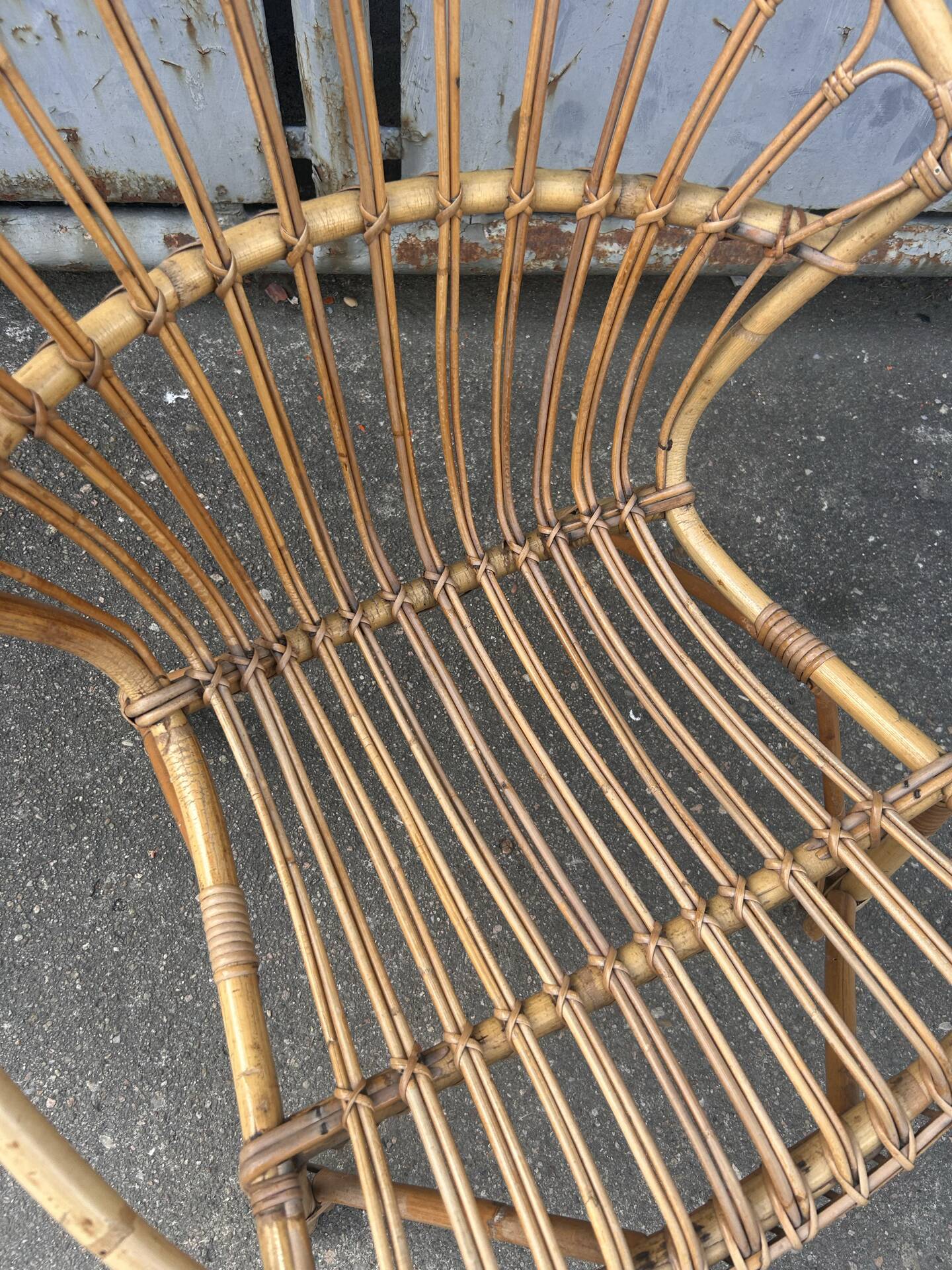 Vintage 1960s rattan shell chair – an icon of bohemian design.