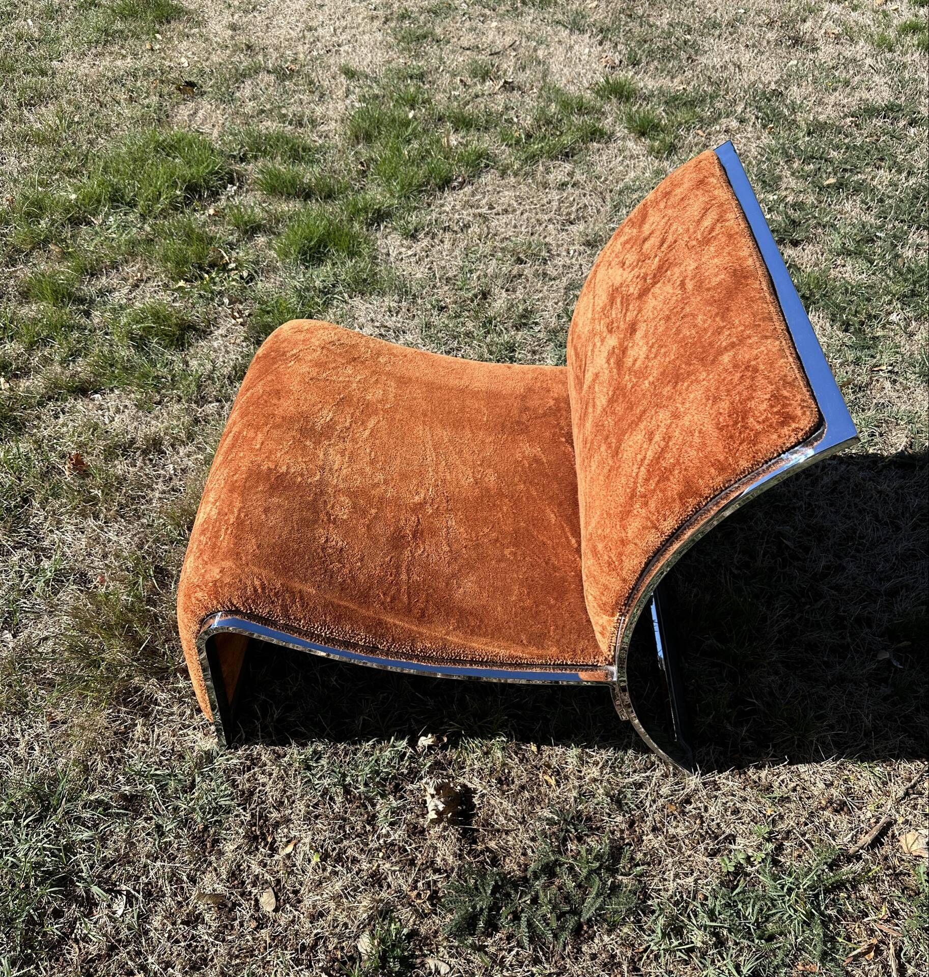 Chrome steel armchair and orange fabric by Vittorio Introini