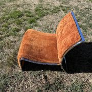 Chrome steel armchair and orange fabric by Vittorio Introini