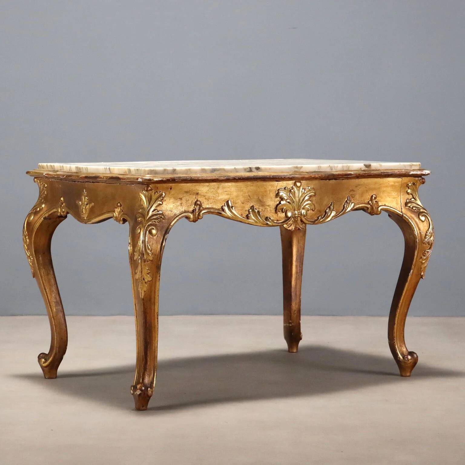 Small antique baroque-style table in carved fir and marble from the 19th century.