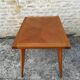 Oak table has two vintage extensions