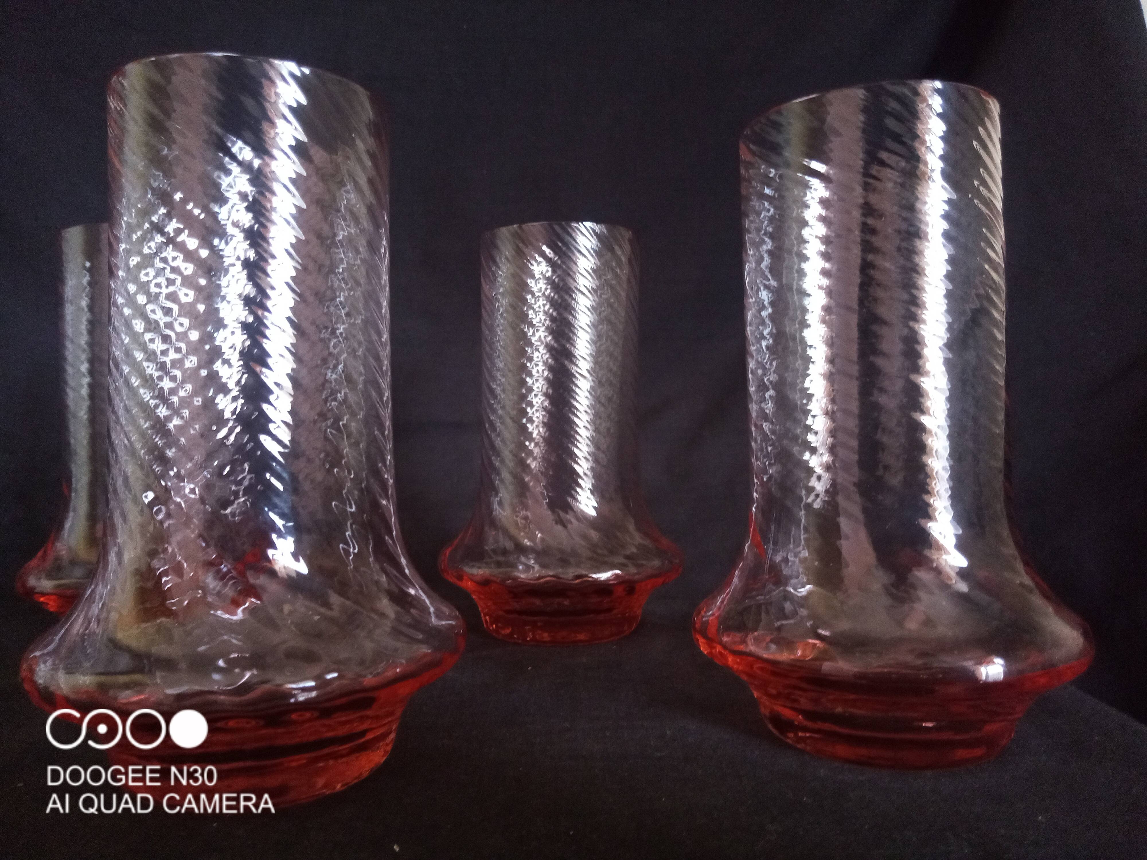 Art Deco orangeade service in pink-orange glass, twisted model.