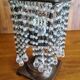 Metal candle holder with white glass tassels