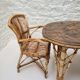 Vintage Audoux Minet bamboo, rattan, and smoked glass table duo.