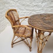 Vintage Audoux Minet bamboo, rattan, and smoked glass table duo.